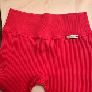 Bombshells leggings XS stretch got good use off them bright red very cute